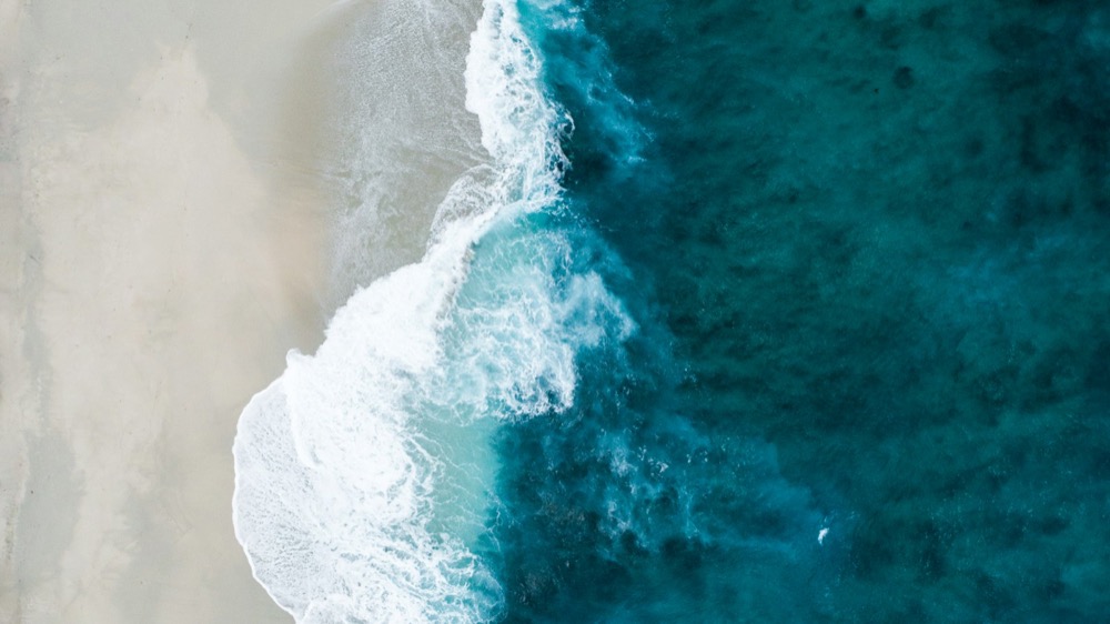 Long ocean swell representing continuous change in market conditions that a risk framework must track.